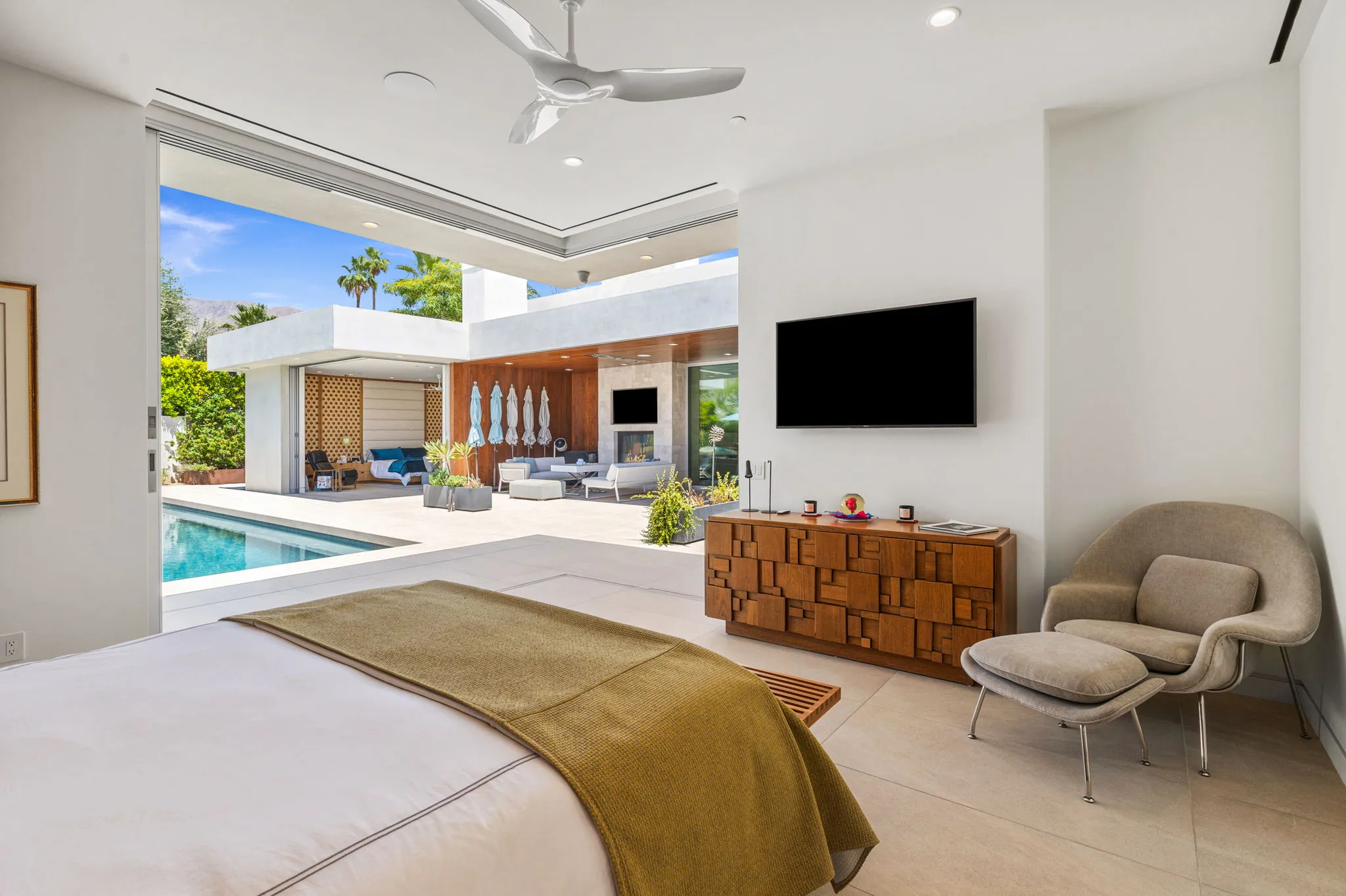 Luxury home remodel in Palm Springs featuring bedroom, wine room, kitchen and outdoor living area
