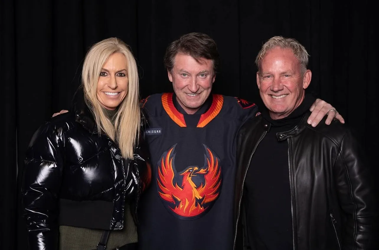Jeff and Kay Larson at hockey game with Wayne Gretzky