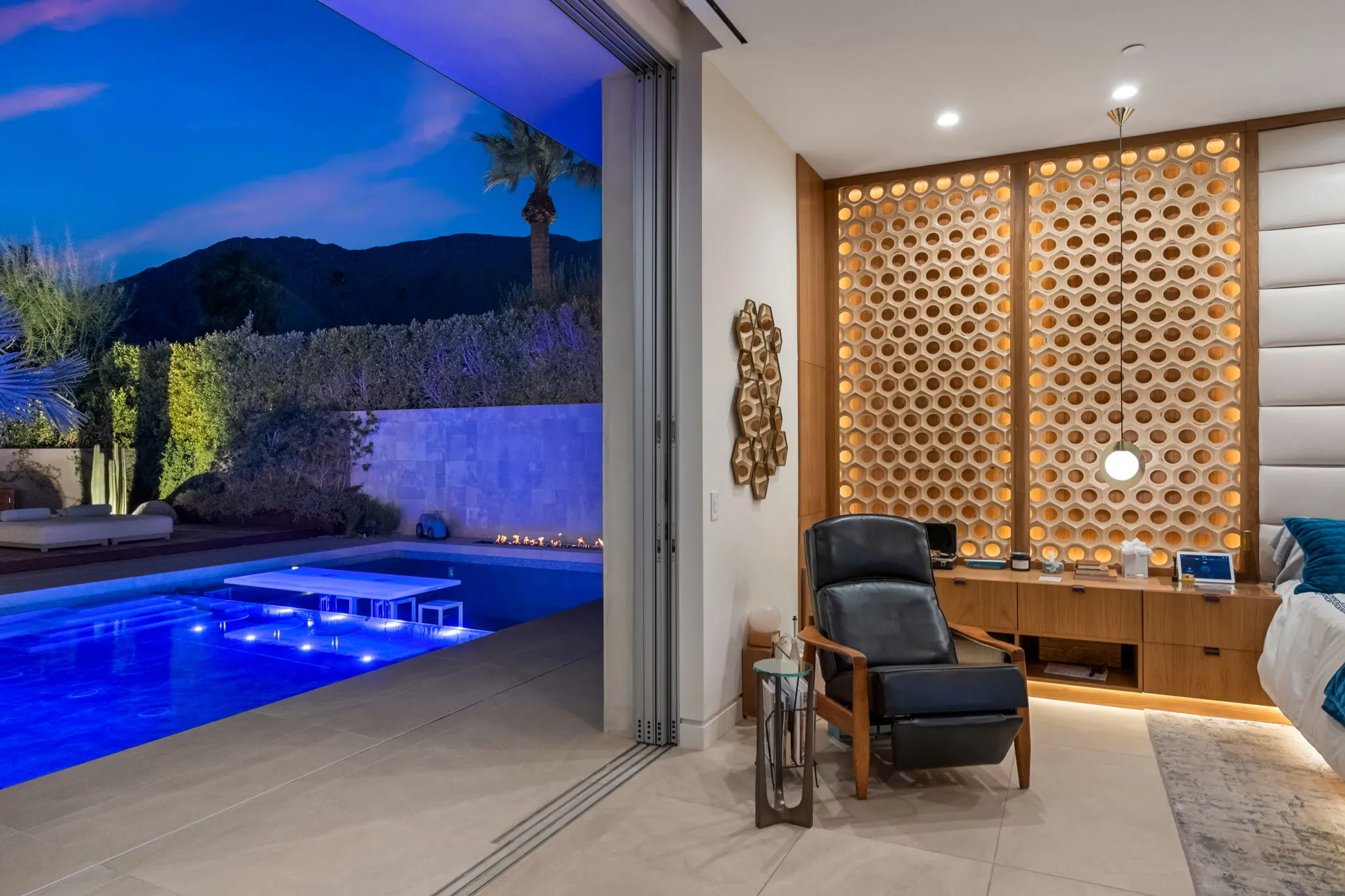 Luxury remodeling contractor in Palm Springs — indoor-outdoor living space at dusk